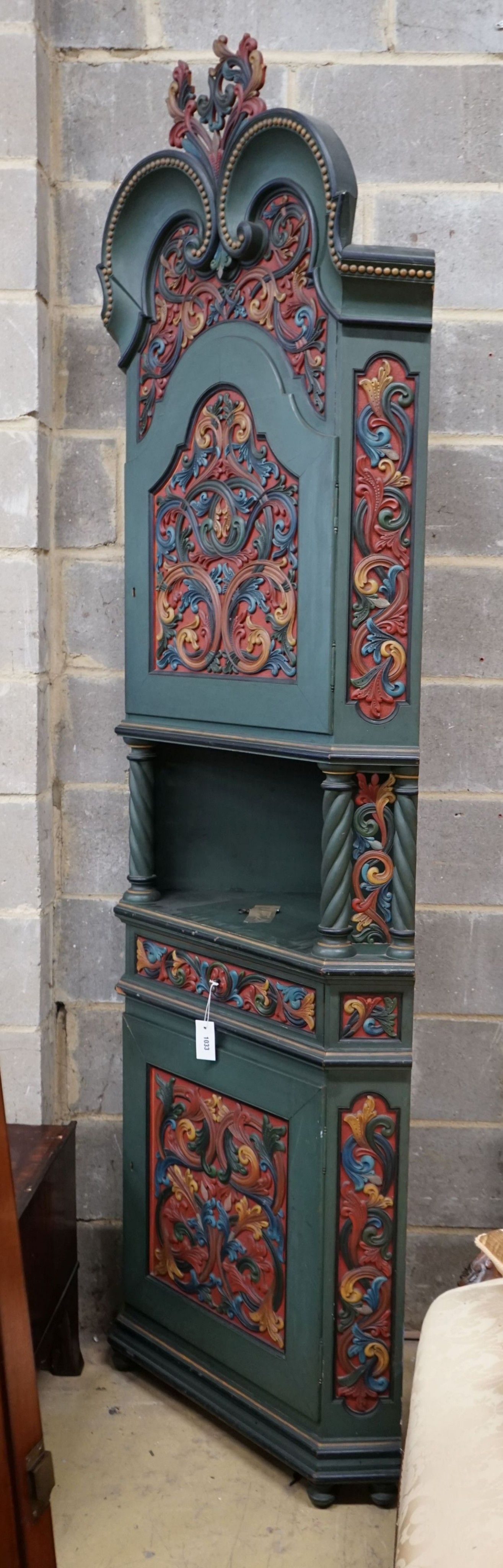 An Italian 18th century style carved polychrome painted standing corner cabinet, width 80cm, depth 46cm, height 240cm